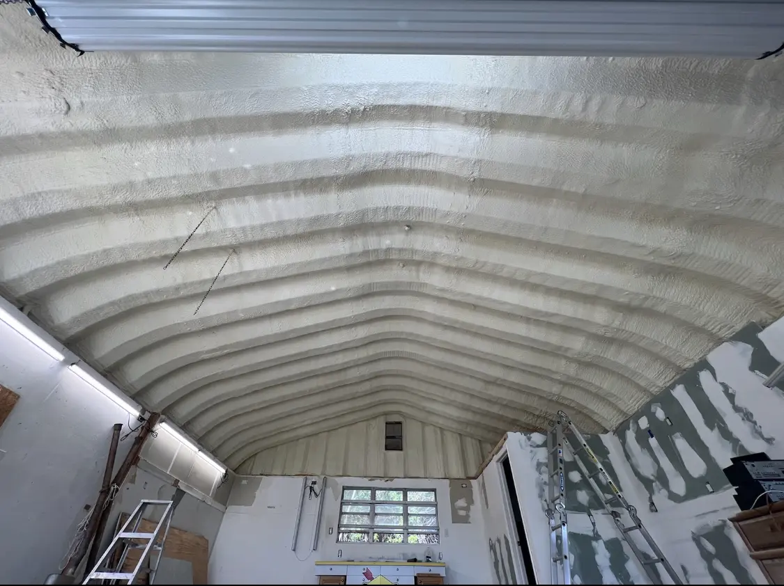 Spray polyurethane foam applied to the underside of a metal roof deck in Framingham